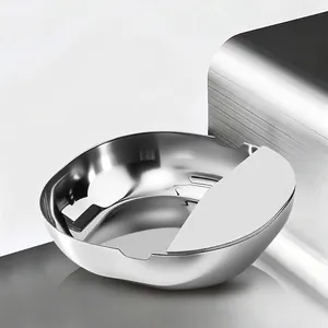 Polished stainless steel spoon and lid rest rack for kitchen countertop organization