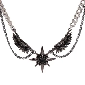 Detailed macro view of a Gothic dark wing star necklace with black gemstones in punk Y2K style