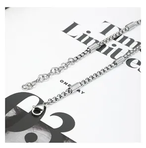 Close-up of titanium steel box chain necklace with lobster clasp and cylinder beads