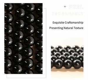 Macro close-up showing the high gloss and natural texture of black obsidian round beads