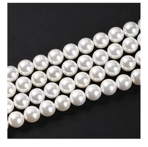 Macro view of lustrous white South Sea shell pearls for DIY jewelry making on black background