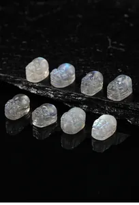 Detailed view of eight carved labradorite Pixiu gemstones showing natural blue flash