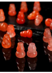 Detailed macro view of translucent cherry red Southern Red Agate gourd beads for jewelry making
