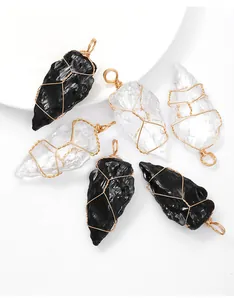 Close-up detail view of six handmade copper wire wrapped arrowhead crystal pendants