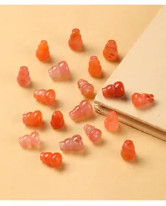 Macro detail of translucent cherry red carnelian agate gourd-shaped jewelry beads