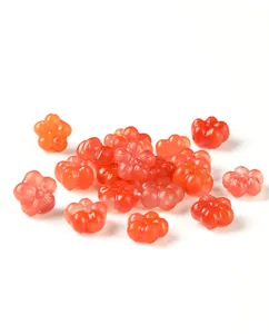 Close-up of South Red Agate plum blossom carved loose beads for DIY jewelry making