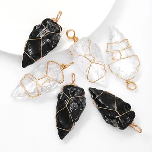 Handmade wire-wrapped arrowhead crystal pendants in black and clear quartz for jewelry