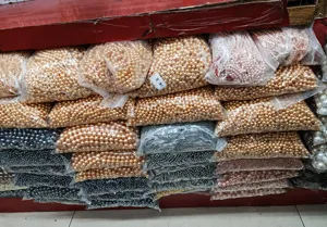 Bulk packs of Nanyang white shell pearls in various colors for DIY jewelry making