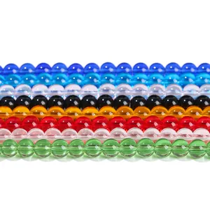 Vibrant multi-colored glass loose beads in various hues for DIY jewelry crafting projects.