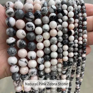 Vue détaillée de perles rondes en pierre de zèbre rose naturelle pour bijoux DIY