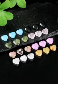 Detail showing heart-shaped natural stone beads in various colors for jewelry making.