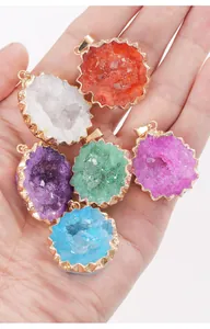 Close-up view of colorful natural crystal druzy agate pendants featuring gold plated edges