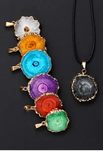 Detailed view of colorful agate druzy sunflower pendants with elegant gold-plated edges