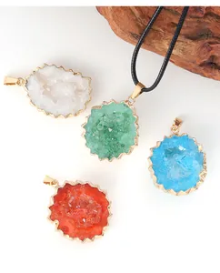 Detailed view of colorful natural crystal druzy agate pendants with gold plated edges.