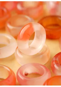 Macro detail of translucent natural southern red agate ring with orange patterns