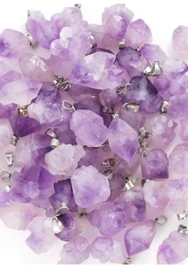 Close-up of irregular light purple amethyst raw stone pendants with silver bails