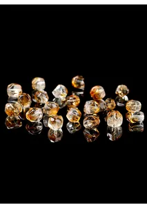 Detailed macro view of high-transparency faceted Brazilian citrine irregular beads for jewelry