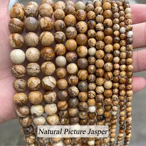 Vue détaillée de perles en jaspe paysage naturel de différentes tailles pour bijoux artisanaux