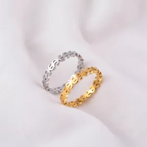Detailed view of minimalist dollar sign rings in gold and silver S925 sterling silver