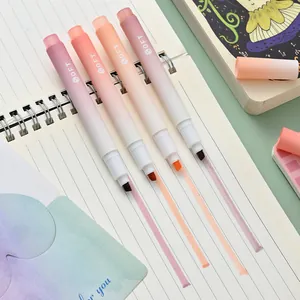 Detail view of four gradient highlighters showing soft pastel color strokes on paper.