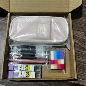 Full stationery set in a box featuring a pink pencil case, pen refills, and pencil leads.