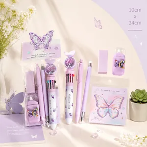 Detail view of purple butterfly stationery set with pens, eraser and correction tape.