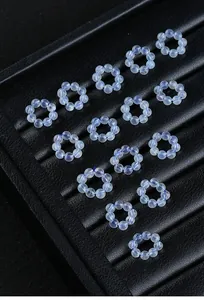 Detailed view of icy blue natural aquamarine bead loops for DIY jewelry making.