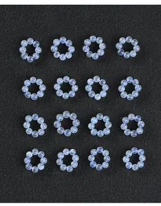 Close-up detail of natural translucent aquamarine round rings for DIY jewelry spacers
