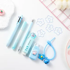 Detailed view of cute light blue cat paw stationery set including pens, eraser and clips