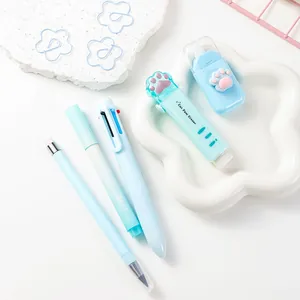 Detail shot of cute cat paw stationery set featuring light blue eraser and pens