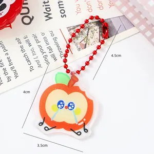 Close-up of cute crying apple acrylic keychain with clear dimension measurements