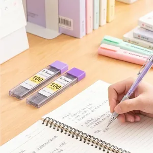 Detailed view of 0.5mm and 0.7mm resin mechanical pencil leads in a cozy study setting