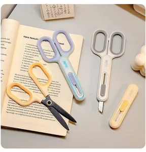 Close-up of the 2-in-1 portable stationery scissors and utility knife in pastel colors