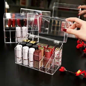 Dustproof transparent acrylic lipstick organizer with lid for desktop vanity storage.