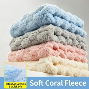 Set of four soft absorbent coral fleece hand towels for quick drying kitchen use