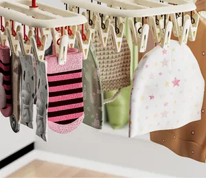 Close-up detail of a beige multi-clip laundry drying rack for baby socks and hats