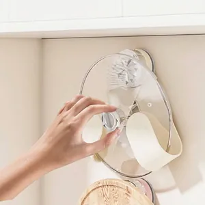 Cream wall-mounted suction cup pot lid holder with rotating triangular design