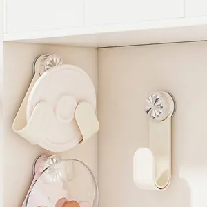 Wall mounted cream suction cup pot lid rack with rotating design for kitchen storage