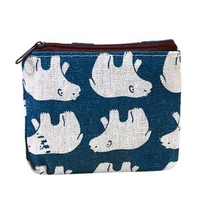 Cute canvas coin purse with white polar bear print on a dark blue fabric background