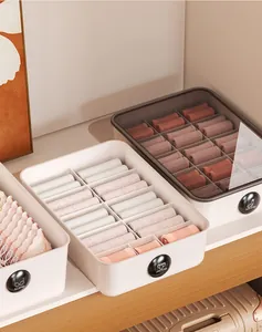 Set of partitioned underwear and sock storage boxes for wardrobe organization.