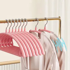 Pink non-slip seamless clothes hangers with curved design for shoulder protection