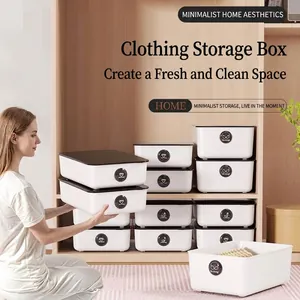 Minimalist white stackable underwear and socks organizer boxes for home closet storage.