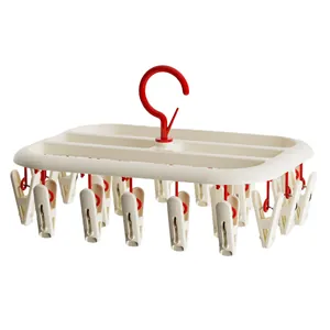 Multi-clip laundry drying rack for socks and baby clothes in beige and red, studio shot.