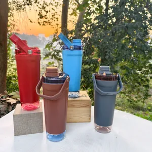 Set of four colorful protein shaker bottles with storage bases in a sunset outdoor setting.