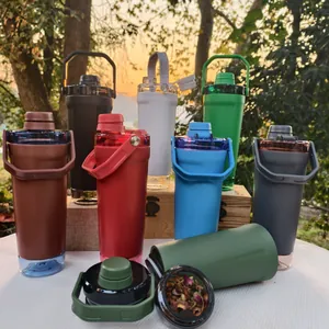 Various colors of large capacity protein shaker bottles with bottom storage and handle