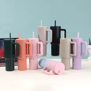 Collection of 40oz stainless steel insulated tumblers with handles and straws in matte colors