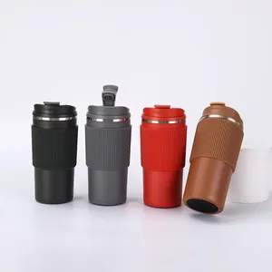 Four insulated stainless steel coffee mugs in black grey red and brown shown together