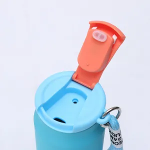 Close-up detail of the flip-top lid on a blue soda can style insulated bottle