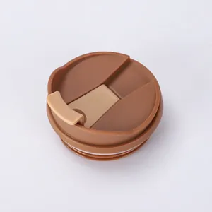 Detailed top view of a brown coffee cup replacement lid with a functional flip cover