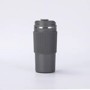Detail of gray 304 stainless steel coffee tumbler with ribbed silicone sleeve